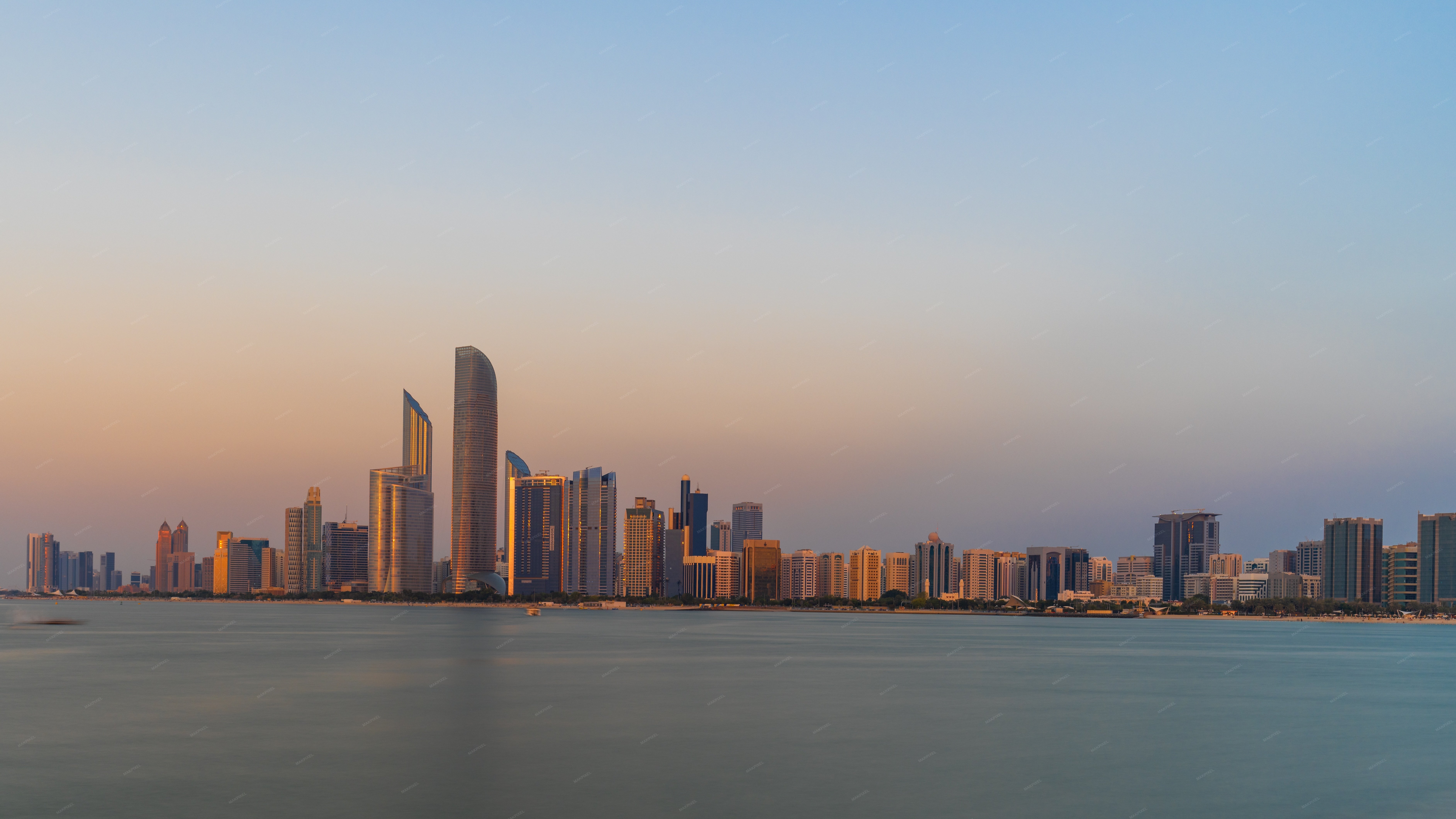 Aerial view of a city skyline at sunset Unknown - Full size view