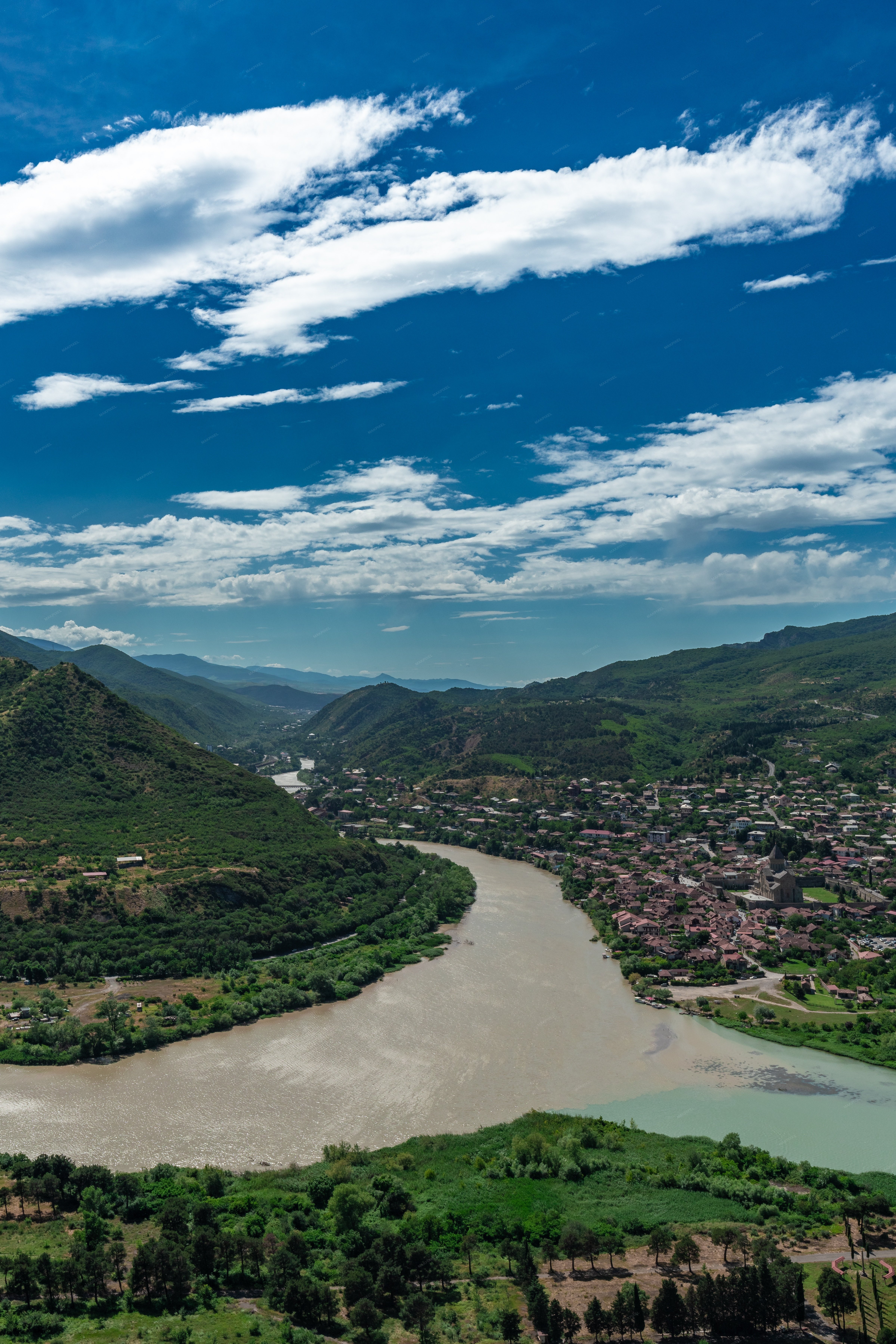 Landscape Featuring A River Flowing Through A Valley - Full size view