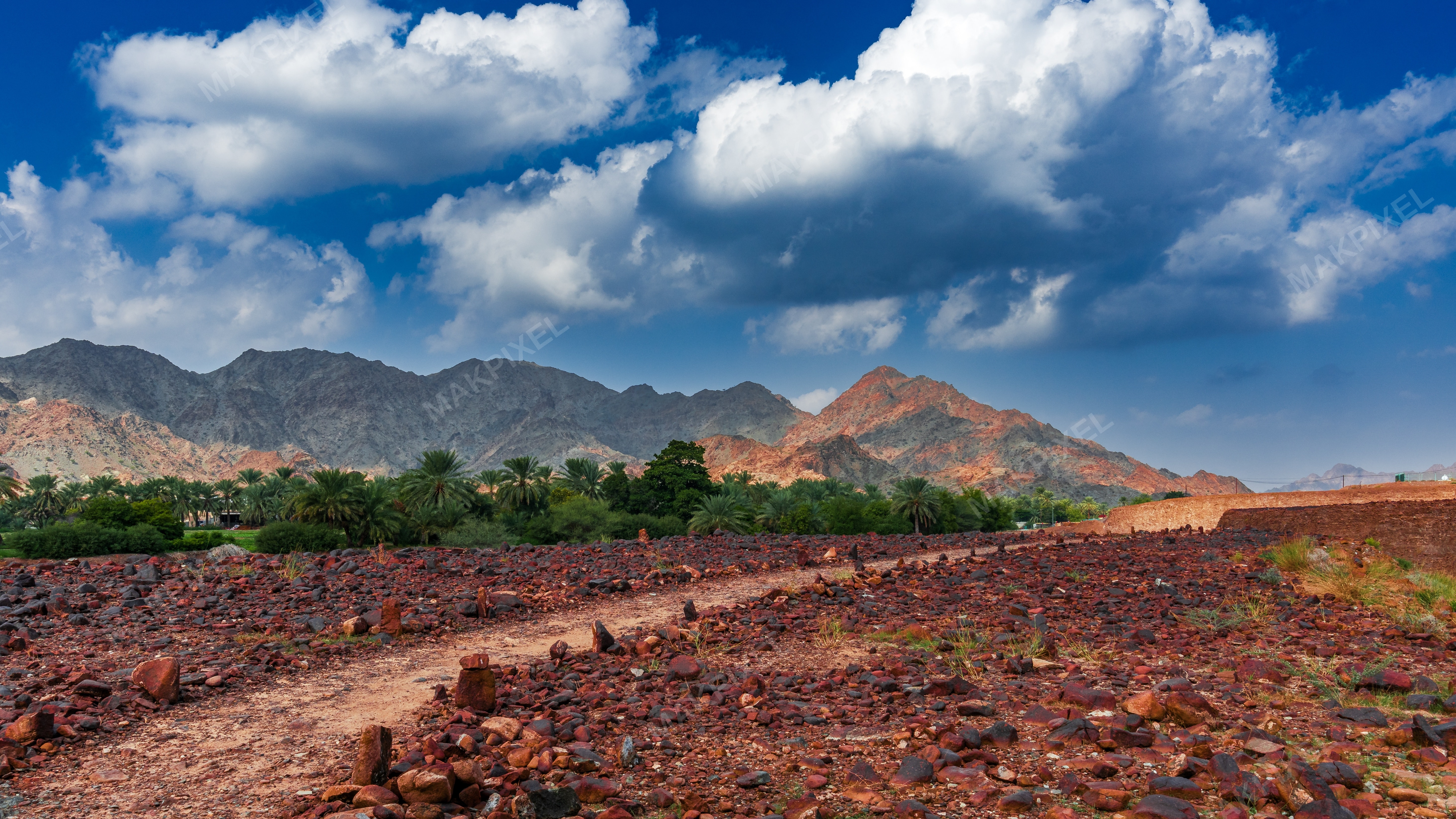 Masafi Image Depicts Vast, Open Landscape blue sky and scattered cloud - Full size view