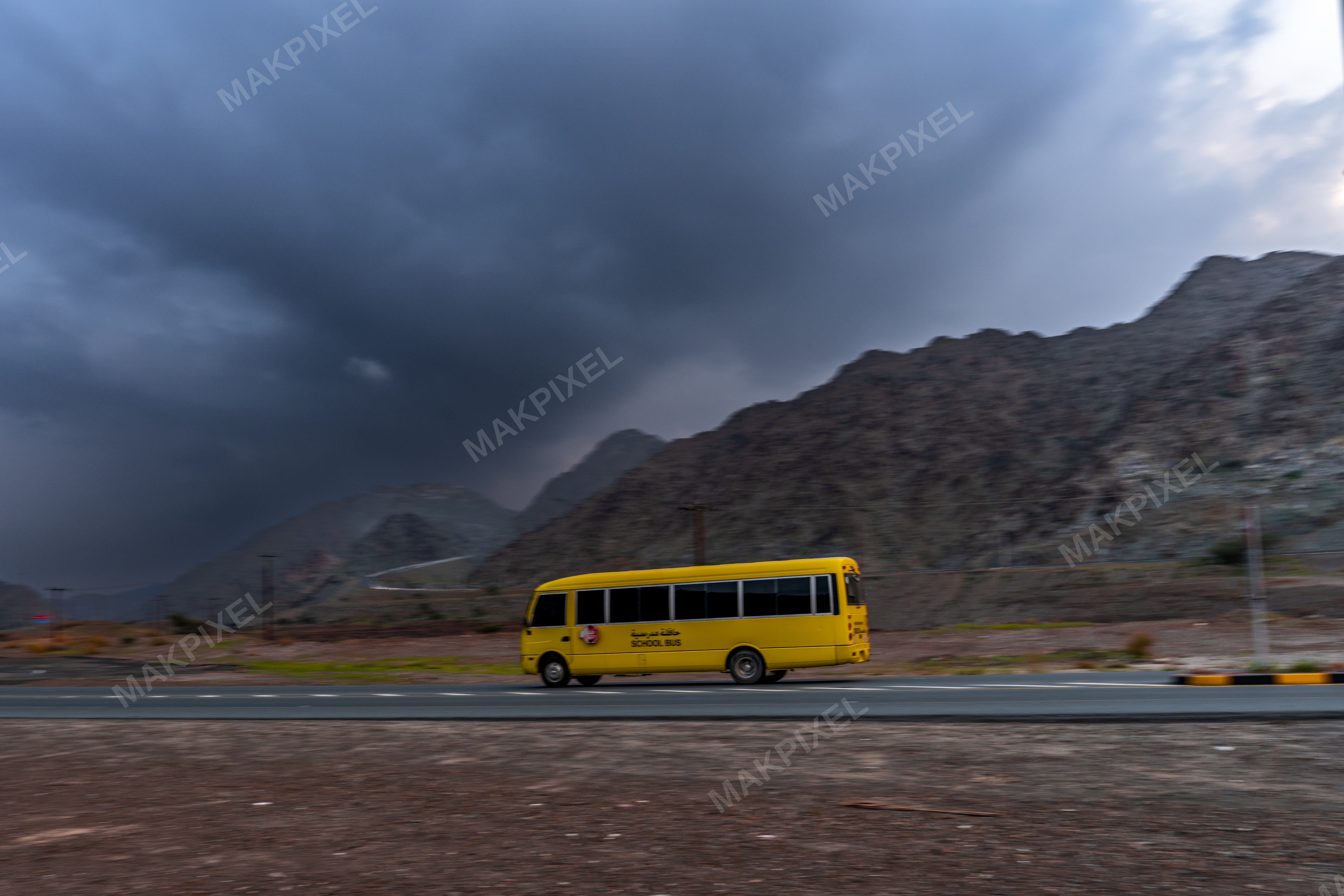 Yellow School Bus on Mountain Road, Masafi UAE – Dramatic Landscape - Full size view