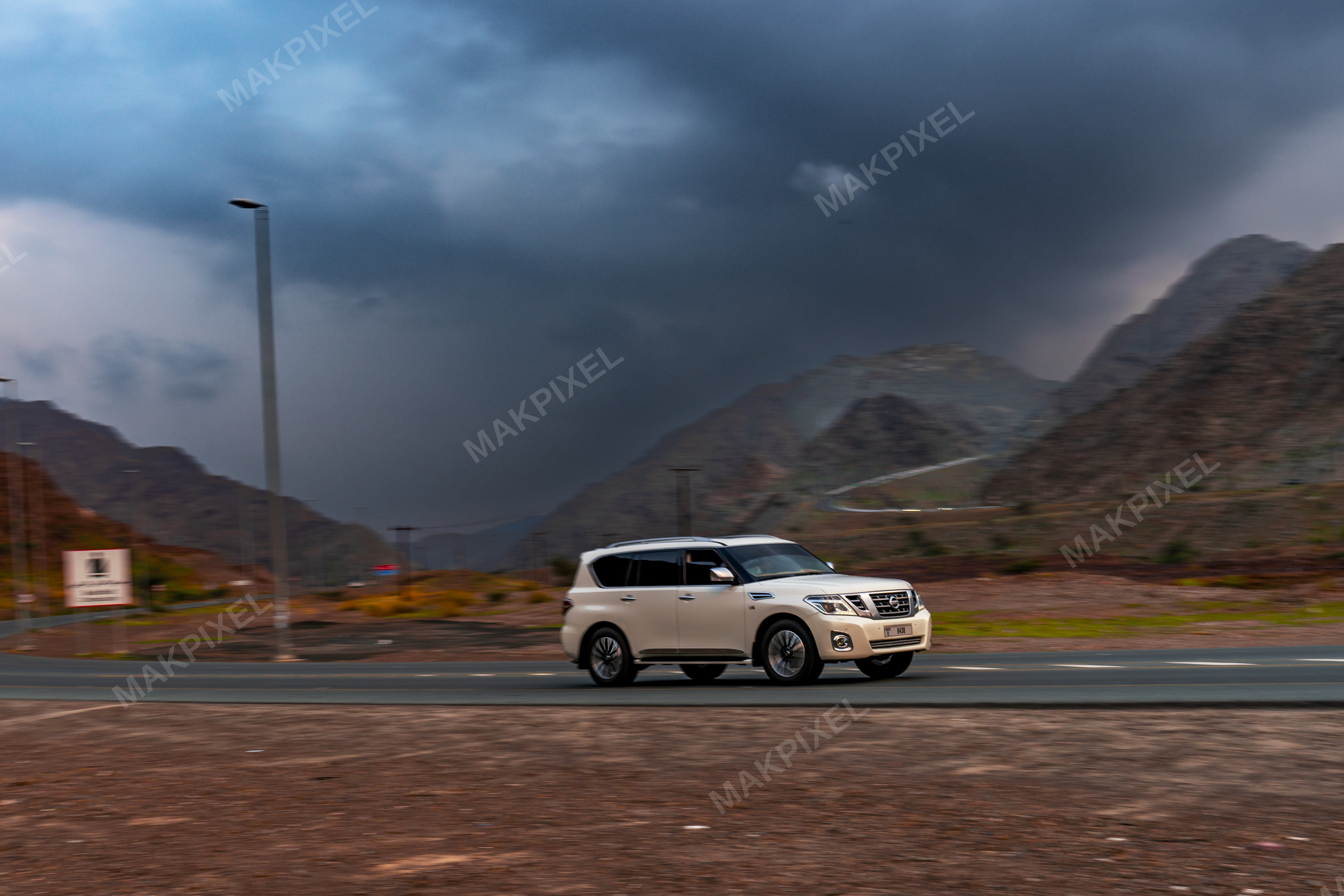 White SUV on Mountain Highway, Masafi UAE – Luxury 4x4, Dramatic Scene - Full size view
