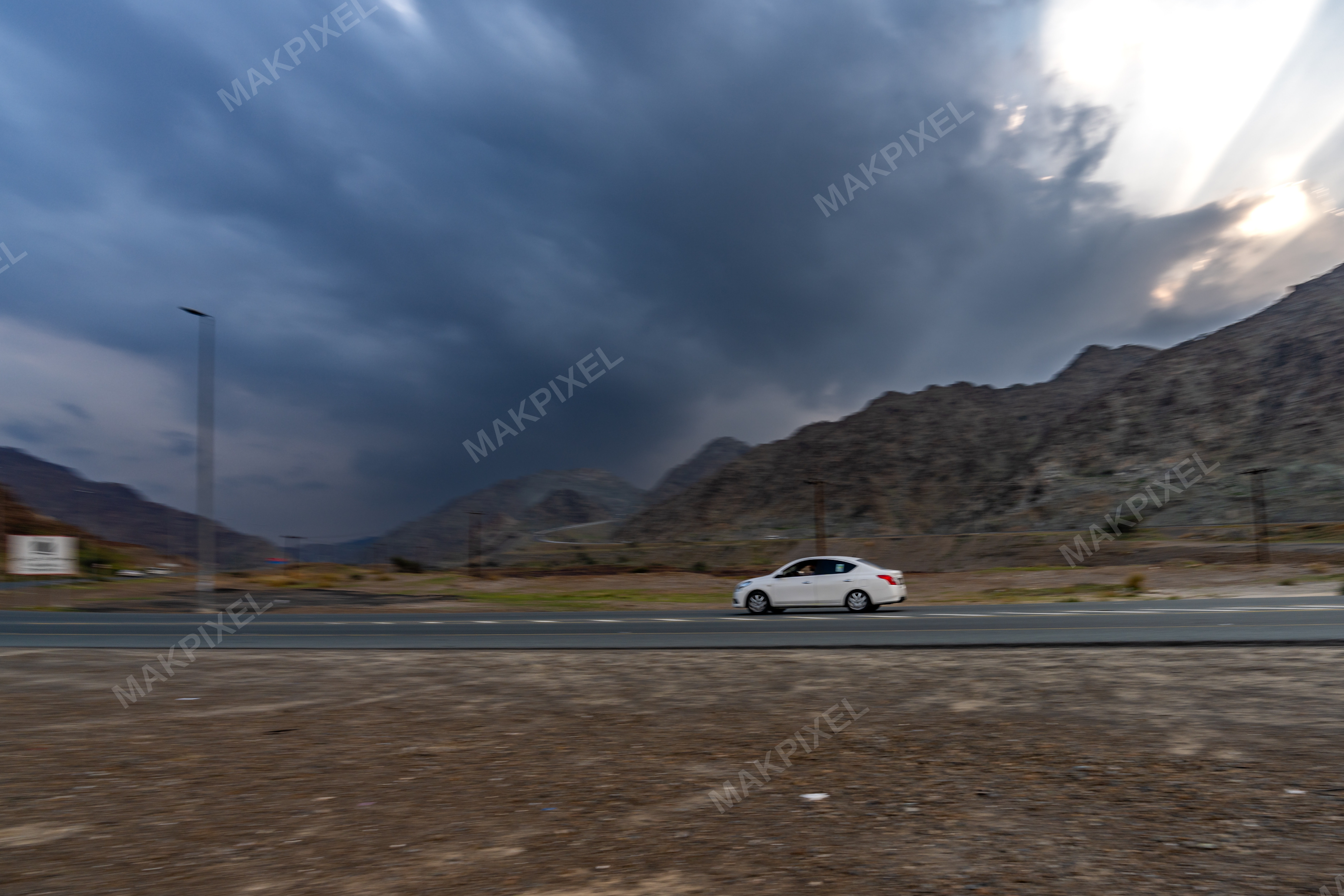 White Sedan Driving Mountain Highway, Masafi Scene - Full size view