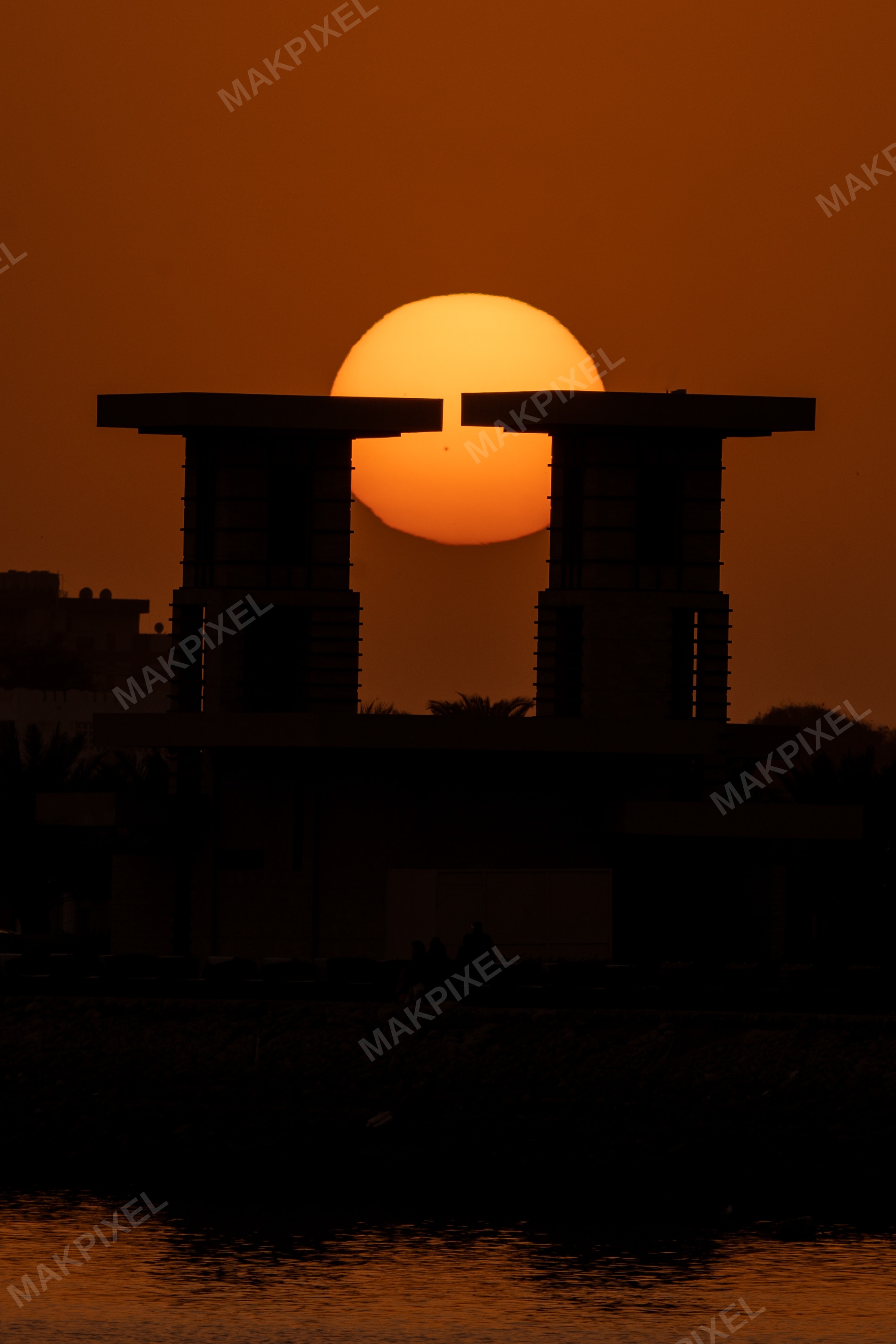 Sunset Split by Modern Towers – Dramatic Silhouette Waterfront, Rak - Full size view