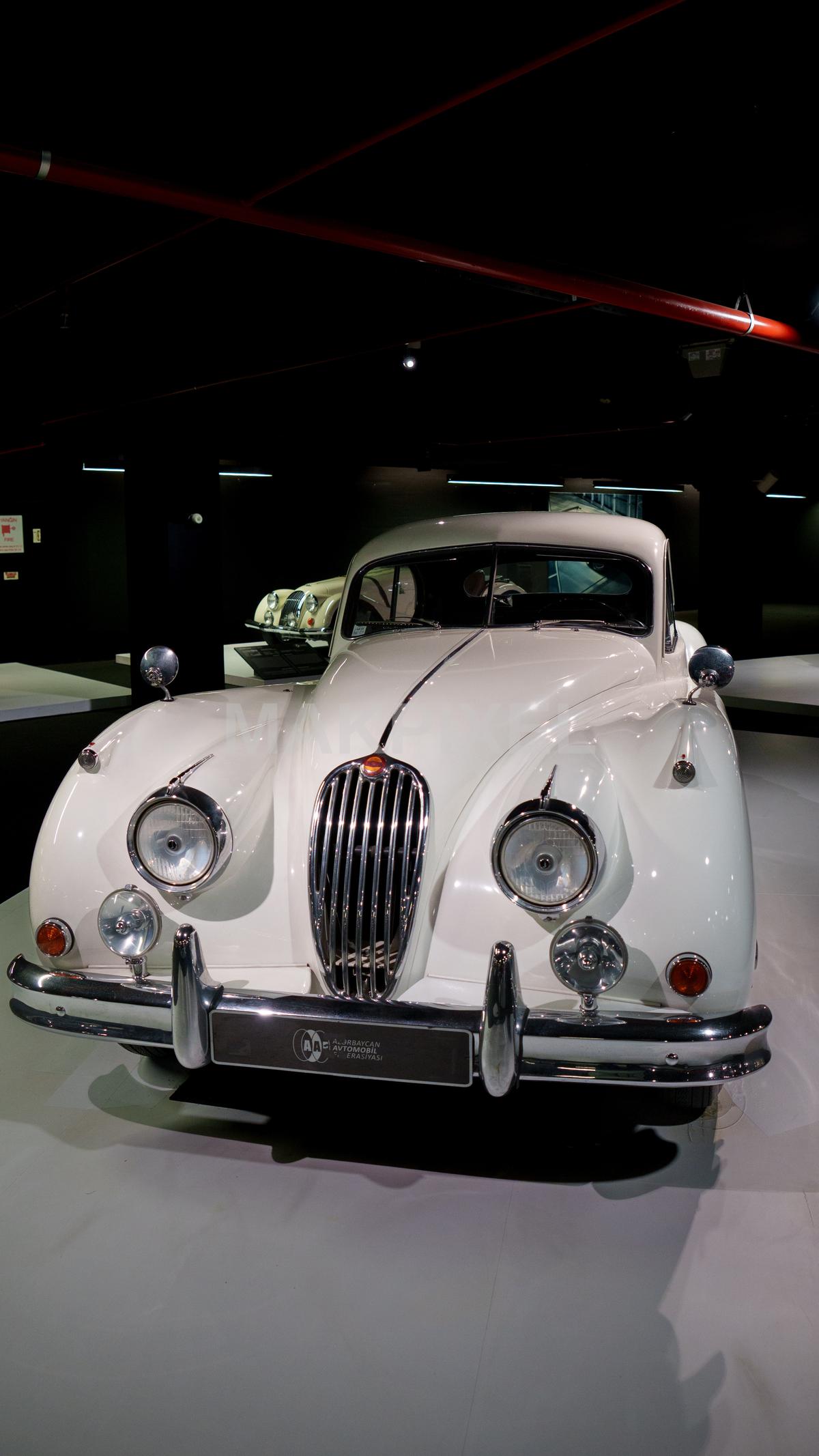 The image shows a classic car on display in an indoor set... - 3510×6240 stock photo