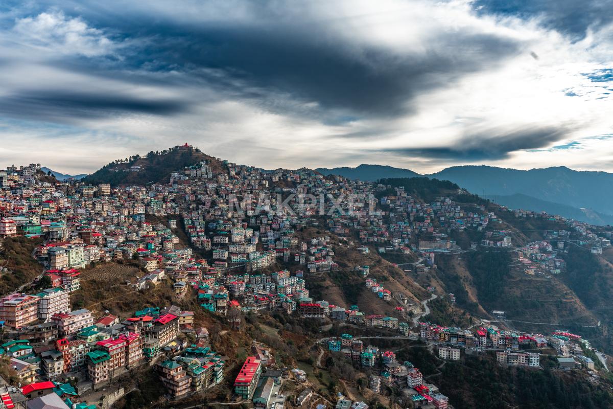 Aerial view of a mountainous region with terraced houses and a clou... - 6928×4619 stock photo