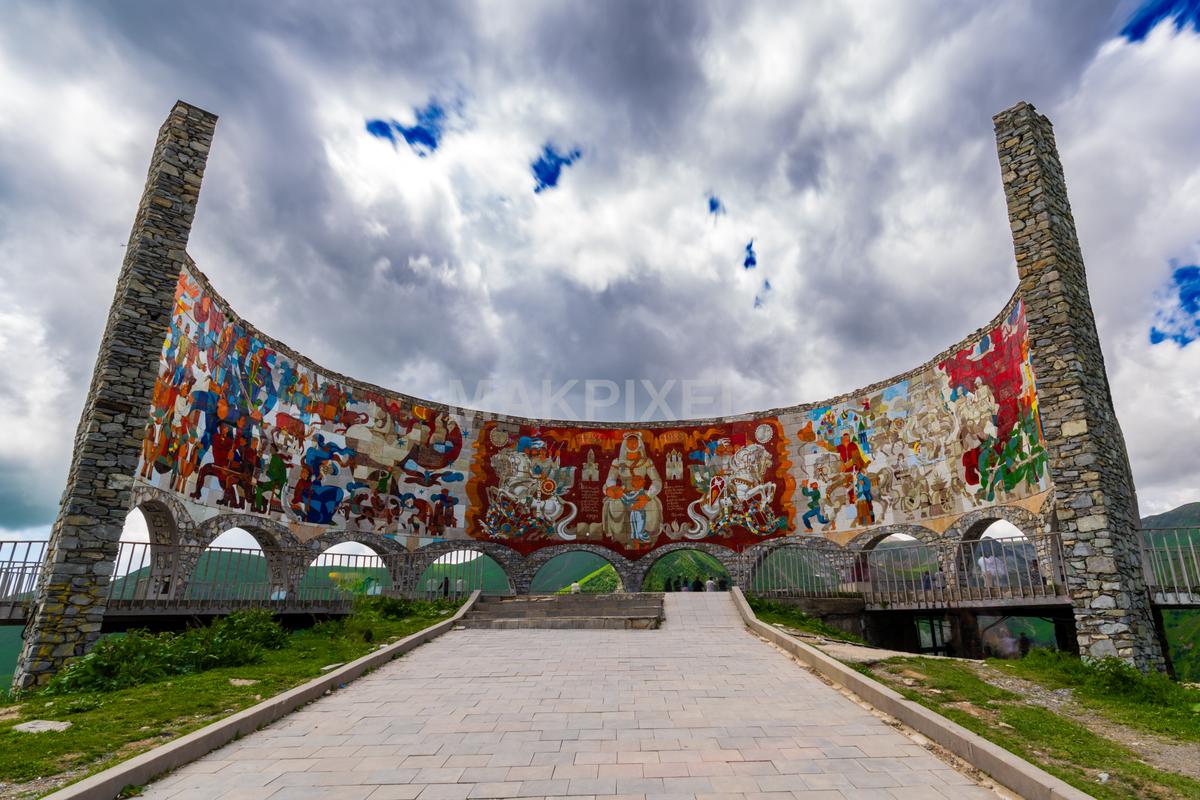 large, colorful mosaic archway with a stone base  on Tbilisi, Georgia - 7958×5305 stock photo