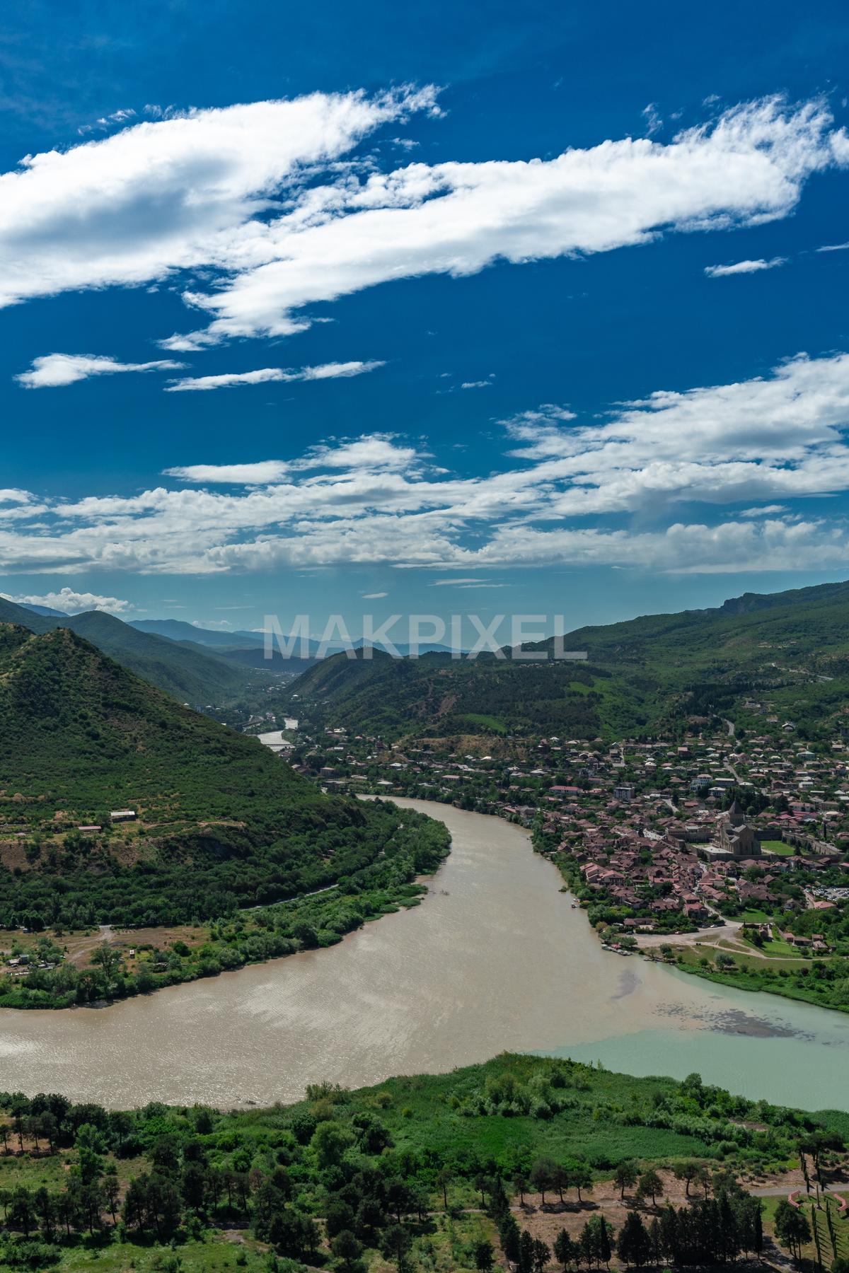 Landscape Featuring A River Flowing Through A Valley - 4797×7195 stock photo