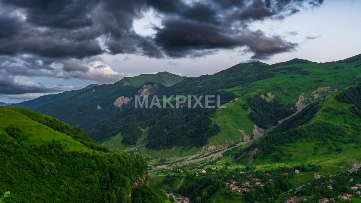The Sky Is Overcast With Dark Clouds, Which Casts A Dramatic - 5494×3090 stock photo