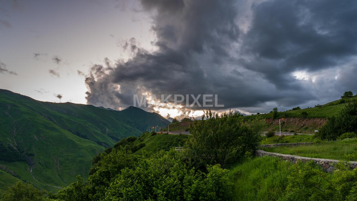 Dramatic Sunset Over Green Mountains In Kazbegi Stock Photo - 7319×4117 stock photo