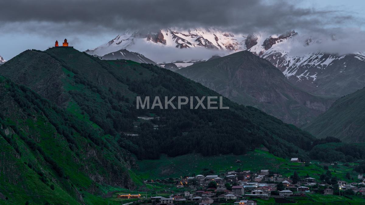 Kazbegi A Mountainous Landscape With A Prominent Peak - 9106×5122 stock photo