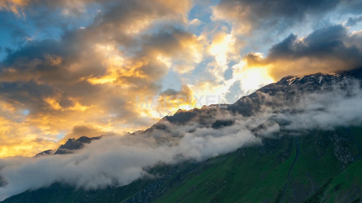 A Natural Landscape Scene With A Mountain Range background clouds - 4379×2463 stock photo