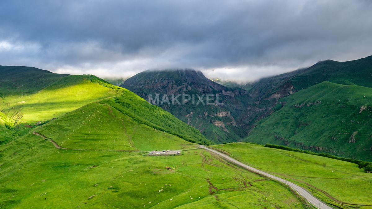 Kazbegi View Mountainous Landscape Under Overcast Sky. - 8590×4832 stock photo