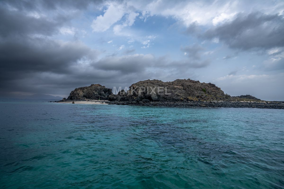 Korfakhan Coastal Scene Island Prominently Featured Center. - 9504×6336 stock photo