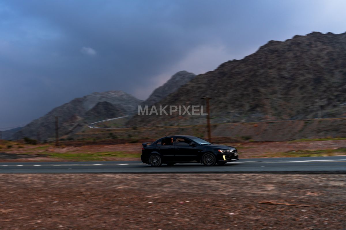 Black Sedan Mountain Road, Masafi Scenic Drive, Dramatic - 7787×5191 stock photo