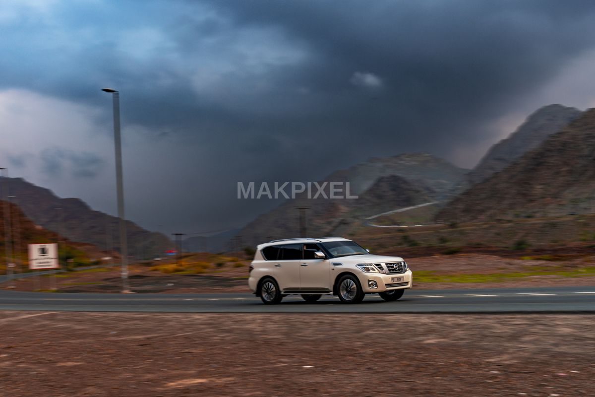 White SUV on Mountain Highway, Masafi UAE – Luxury 4x4, Dramatic Scene - 7265×4843 stock photo