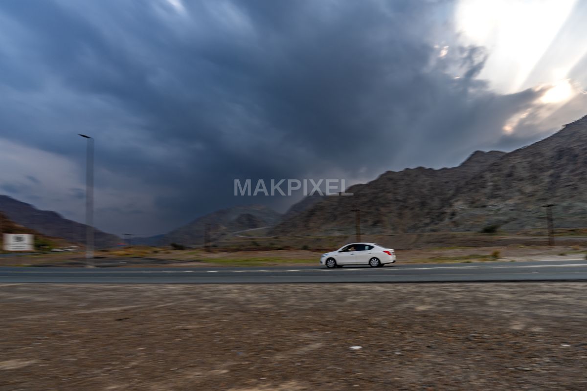 White Sedan Driving Mountain Highway, Masafi Scene - 7532×5021 stock photo