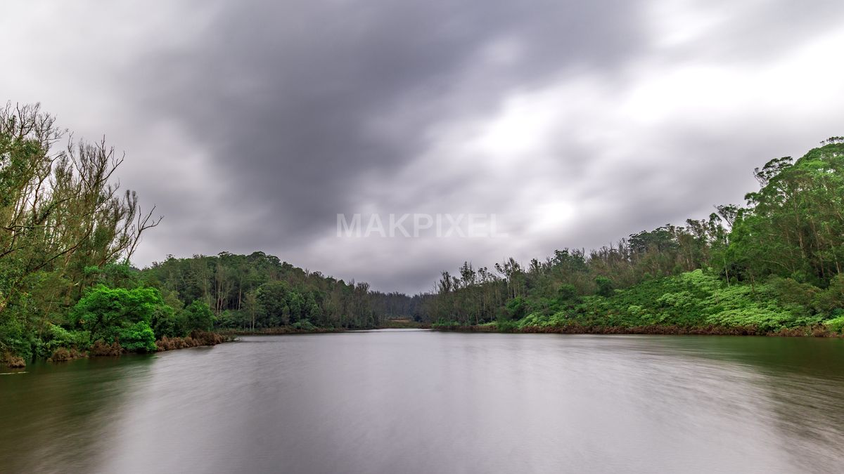 Ooty Lake with Dramatic Monsoon Clouds – Calm Water, Lush Green Forest - 5489×3088 stock photo