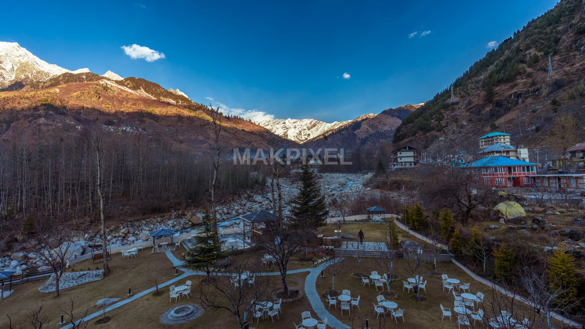 Riverside Resort Garden Snow Mountain View Scenic Landscape - 6597×3711 stock photo