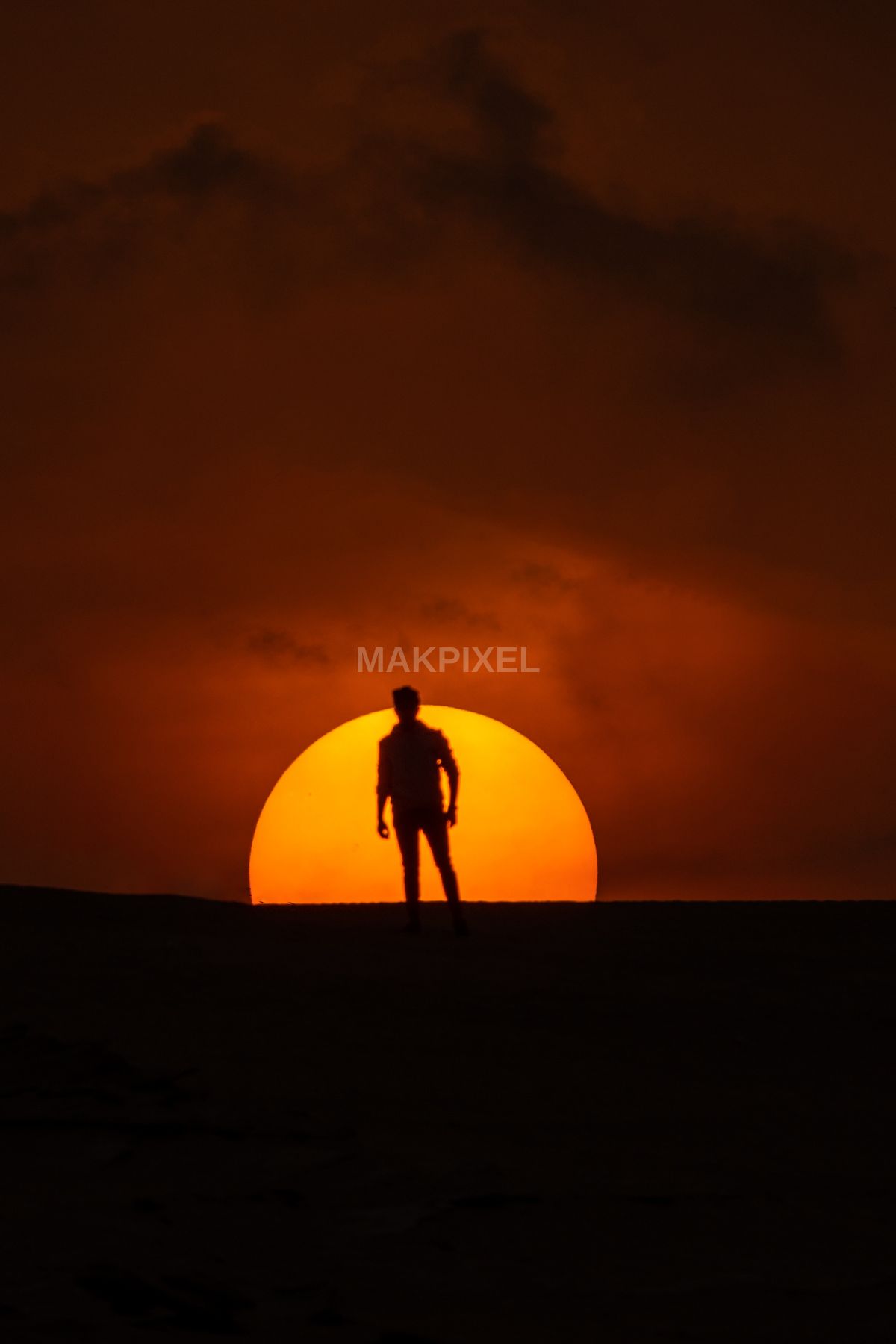 Desert Silhouette with Setting Sun | Person at Sunset, Dramatic Orange - 2445×3668 stock photo
