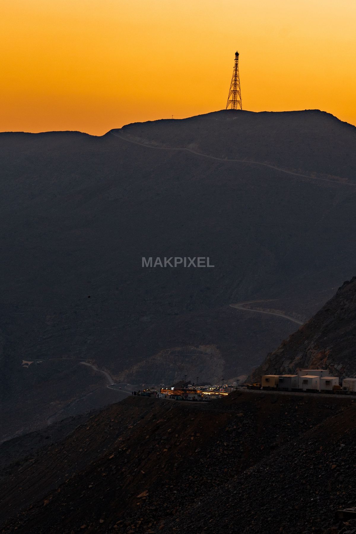 Mountain Silhouette and Sunset Tower – Orange Dusk Landscape, UAE - 2182×3273 stock photo
