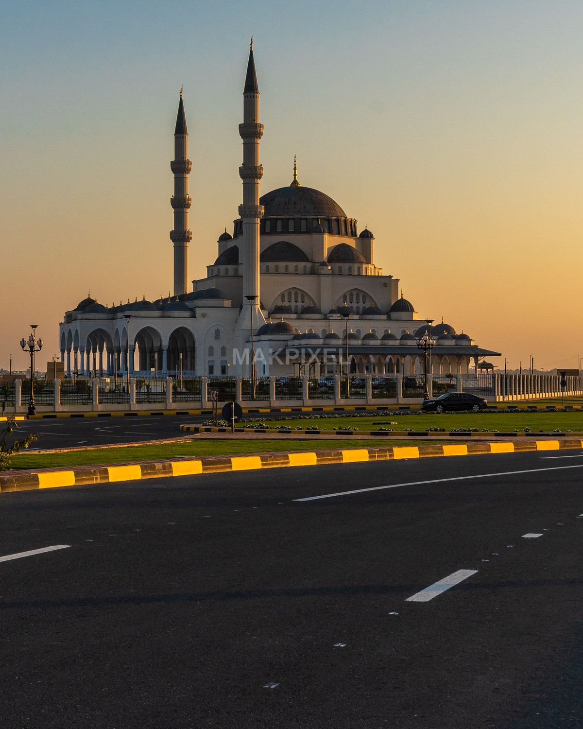 Sharjah Grand Mosque at Sunset Golden Hour Modern Islamic Architecture - 2134×2667 stock photo