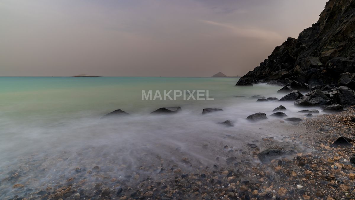 Khorfakkan Beach Long Exposure Rocky Coastline - 7968×4482 stock photo
